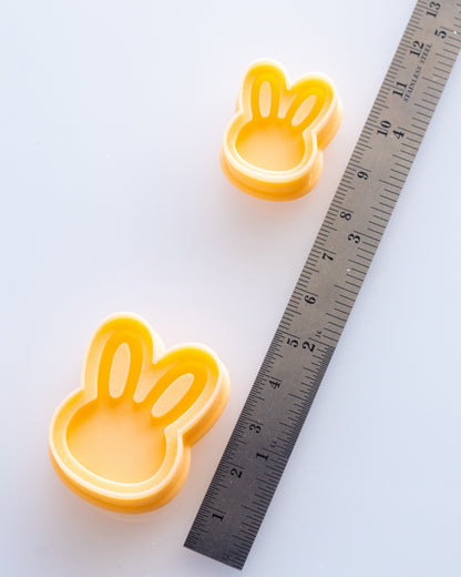 Mini Bunny Head clay cutters shown with a ruler or size lineup to provide a practical scale reference.