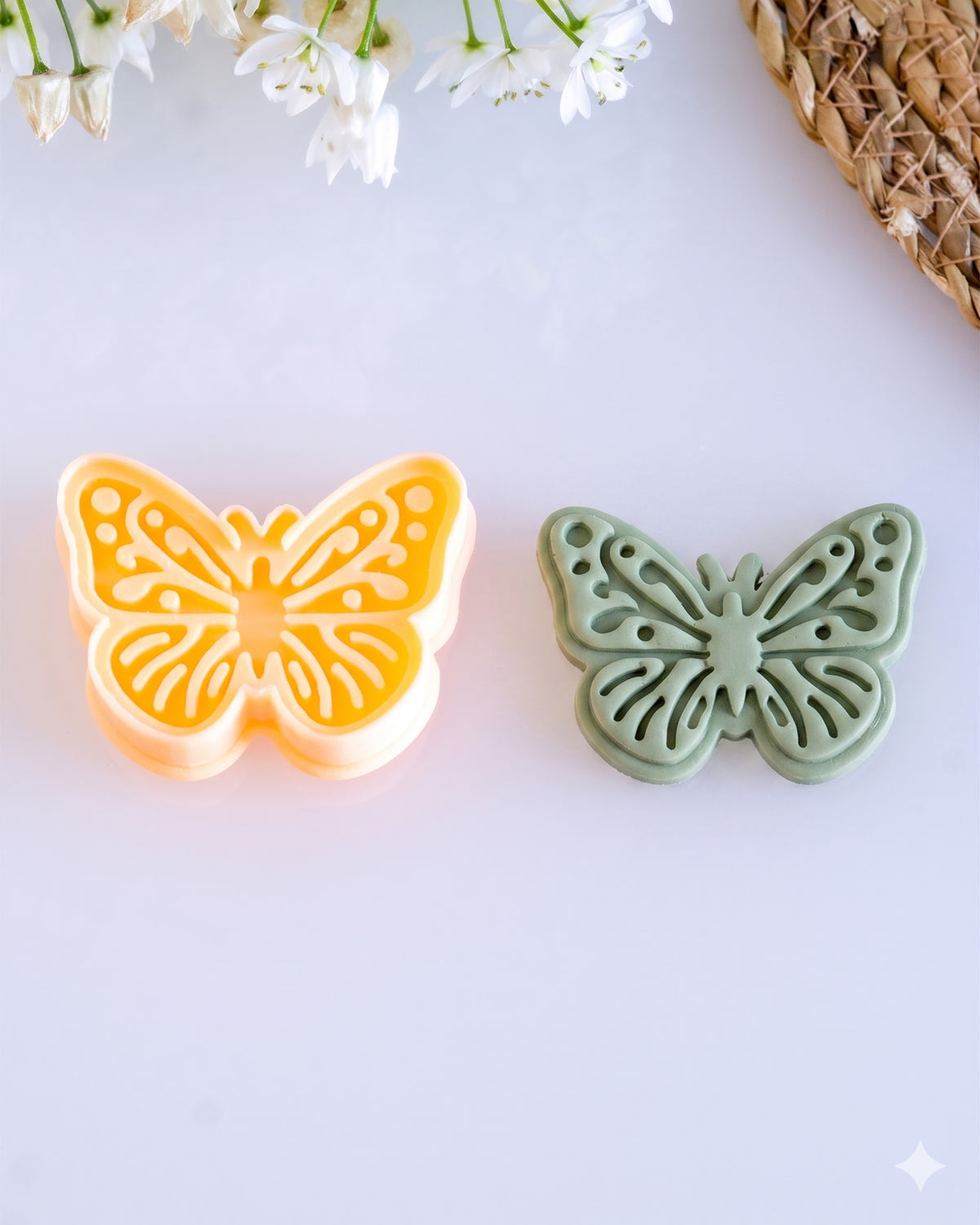 Close product view showing the printed Butterfly clay cutter beside its matching polymer clay imprint.