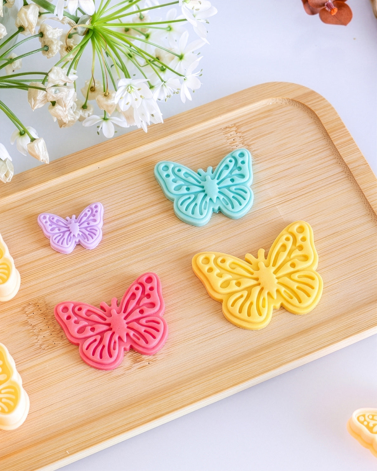 Top view of the Butterfly clay cutter and matching polymer clay result examples.