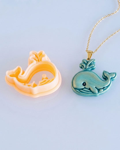 Close product view showing the printed Cartoon Whale clay cutter beside its matching polymer clay imprint.