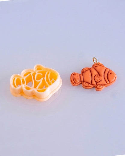 Close product view showing the printed Clownfish clay cutter beside its matching polymer clay imprint.