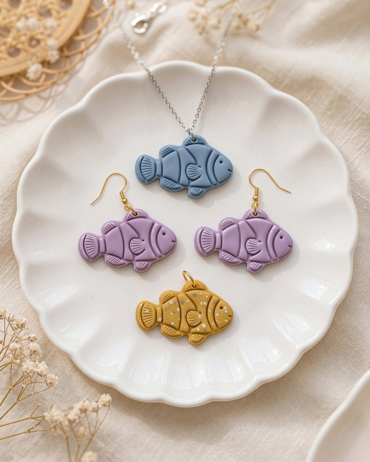 Close view of finished polymer clay jewelry made with the Clownfish cutter design.