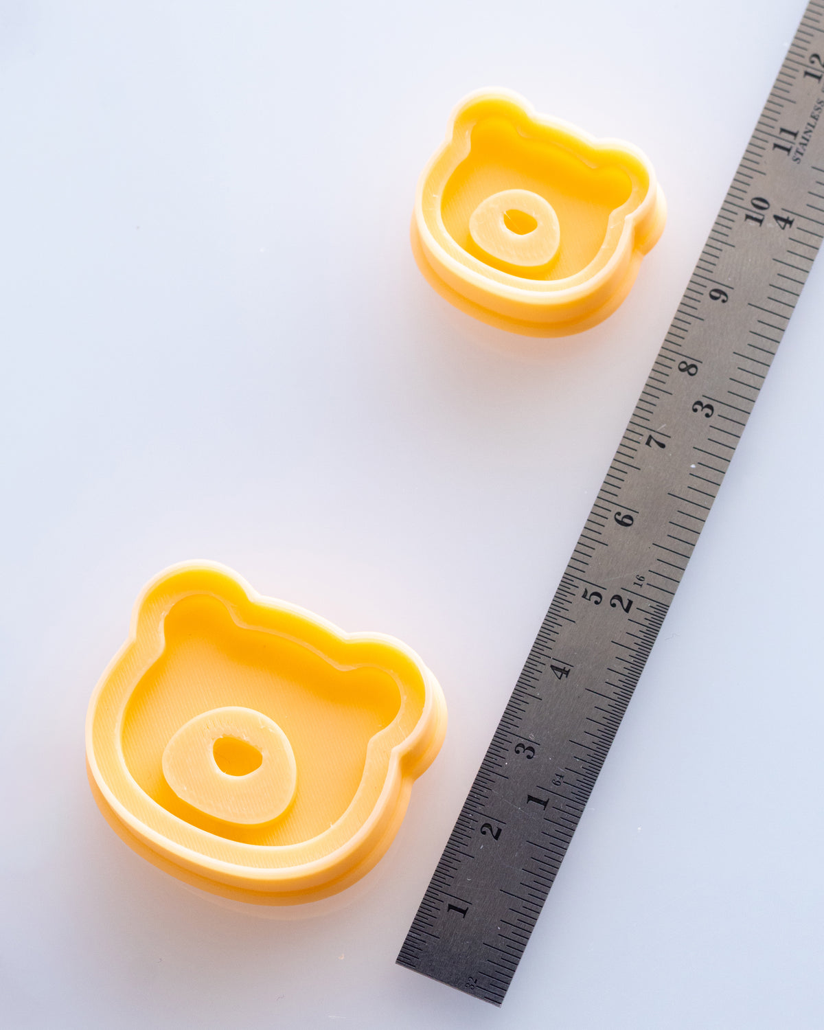 Mini Bear Face clay cutters shown with a ruler or size lineup to provide a practical scale reference.