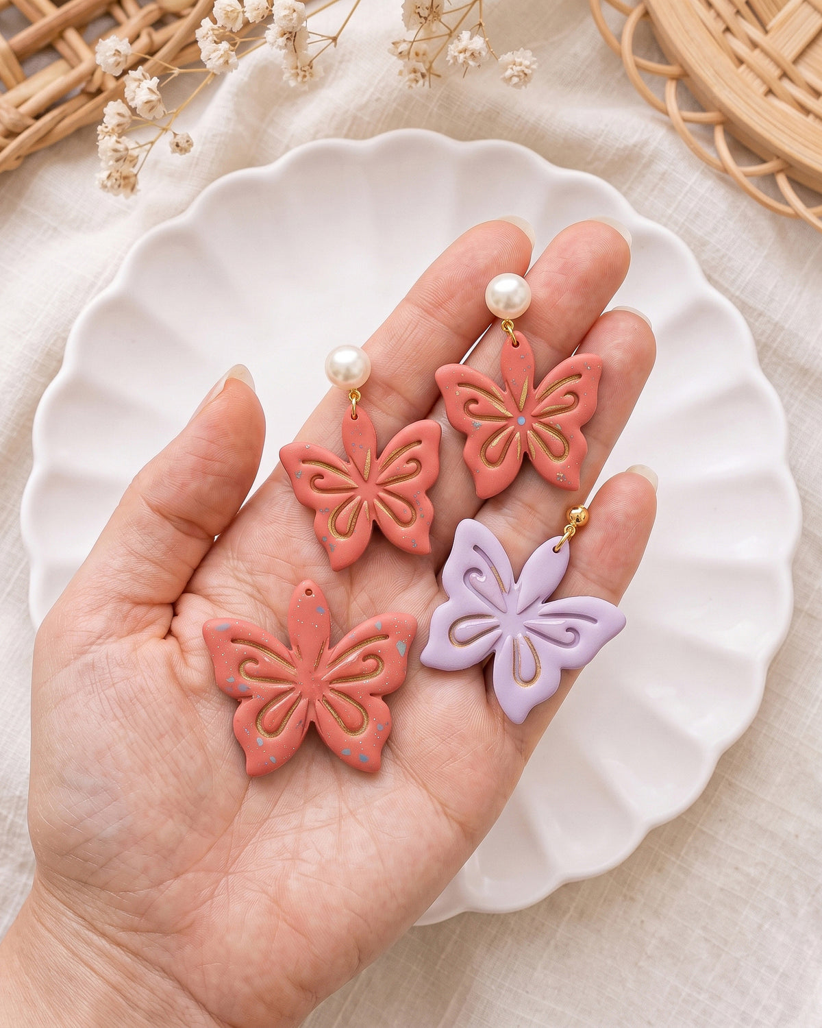 Hand-scale photograph showing the relative size of a finished Ornamental Lotus polymer clay piece.