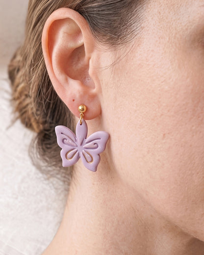 A model wearing finished Ornamental Lotus polymer clay jewelry, showing its appearance and scale when worn.
