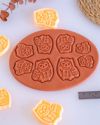 Close product view showing the printed Scandi Owl clay cutter beside its matching polymer clay imprint.