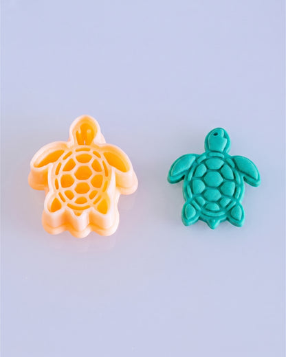 Printed Sea Turtle clay cutter shown beside the matching cut and imprinted polymer clay result.