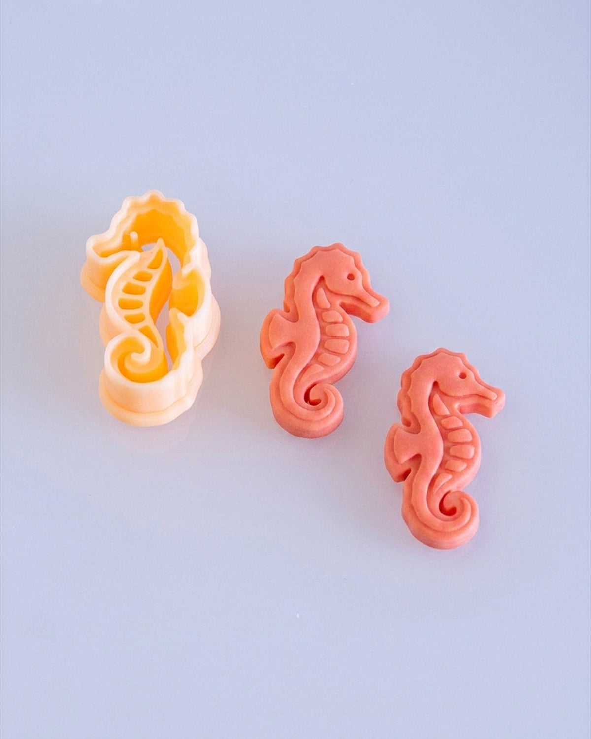 Close product view showing the printed Seahorse clay cutter beside its matching polymer clay imprint.