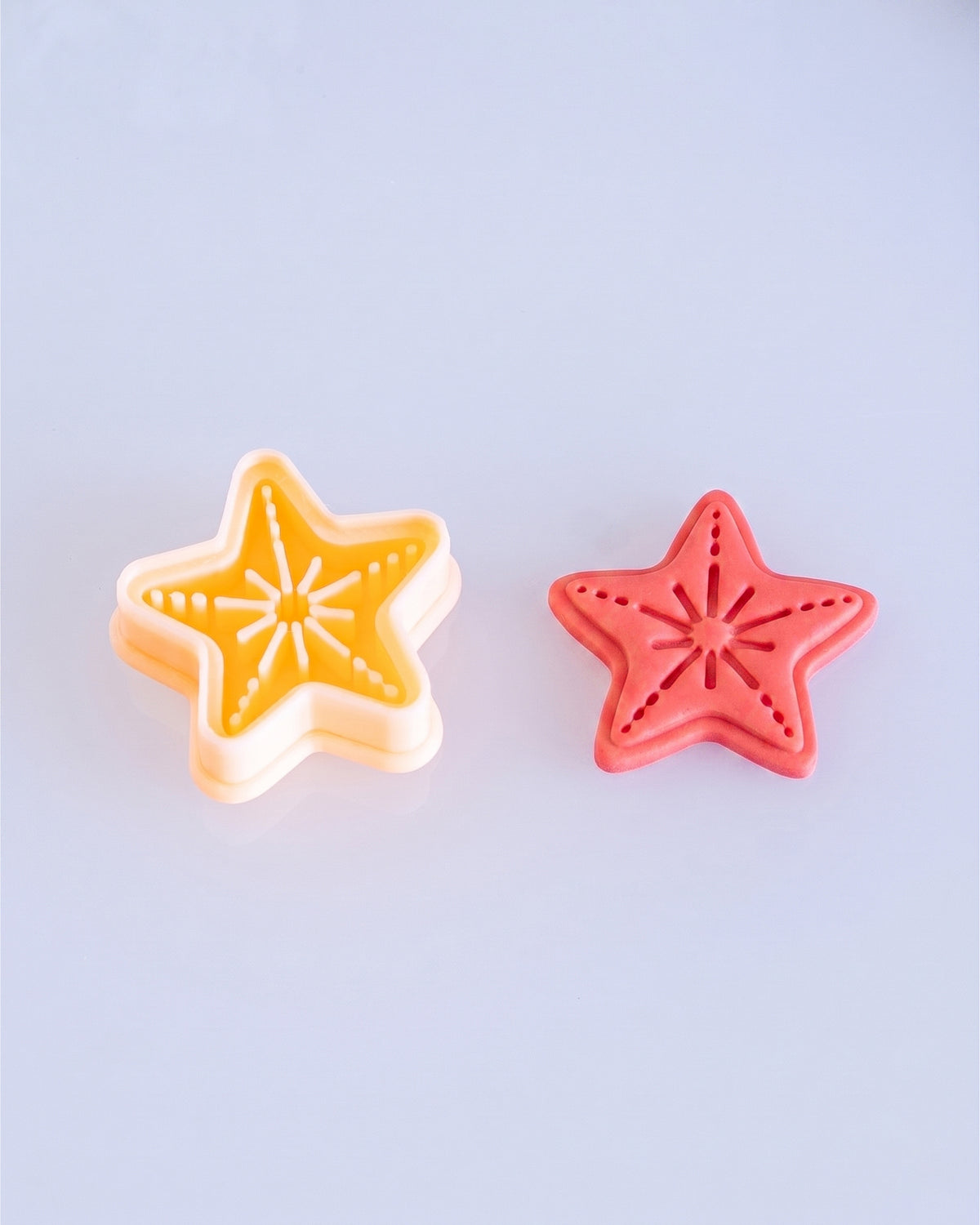 Close product view showing the printed Starfish clay cutter beside its matching polymer clay imprint.