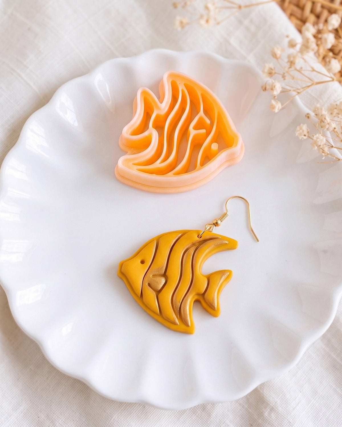 Close product view showing the printed Tropical Angelfish clay cutter beside its matching polymer clay imprint.