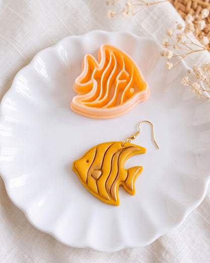 Close product view showing the printed Tropical Angelfish clay cutter beside its matching polymer clay imprint.